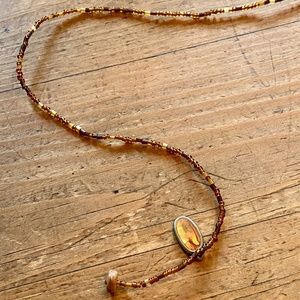 Bronzed amber beaded necklace with pendant